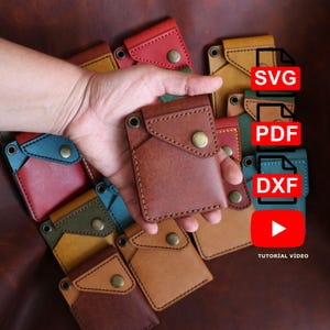 May include: A collection of handmade leather cardholders in various colors, including brown, red, and blue. Each cardholder features a snap closure and is displayed with digital file icons for SVG, PDF, and DXF formats, along with a YouTube tutorial video link.