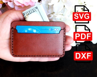 May include: A brown leather card holder with a blue credit card inside. The card has the text "Carrefour kart" on it. The image also includes a stack of US dollar bills and three file icons labeled "SVG", "PDF", and "DXF".