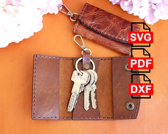 Puede incluir: Dos llaveros de cuero marrón con un llavero plateado y varias llaves. Los llaveros están abiertos y las llaves son visibles. La imagen incluye el texto "SVG", "PDF" y "DXF".