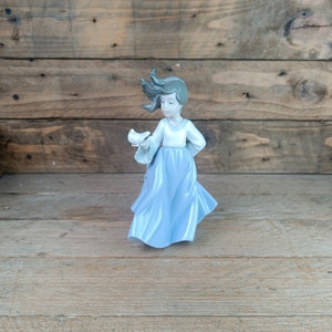 1988, NAO figurine. Windswept girl with dove