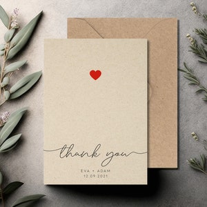 May include: A simple thank you card with a red heart and the text "thank you" in cursive. The card also includes the names "Eva + Adam" and the date "12.09.2021".