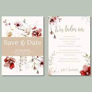 May include: Save the Date wedding invitation with floral design. The invitation features a watercolor illustration of white and red flowers with green leaves. The text "Save the Date" is written in a script font and the date "23.09.2023" is written below. The location "Schloss Lichtenstein" is written below the date.