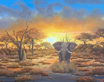 May include: An original painting of an African elephant standing in water at sunset. The artwork features a vibrant sky with shades of orange, yellow, and blue. The elephant is gray with large ears and tusks, surrounded by savanna trees and tall grass.