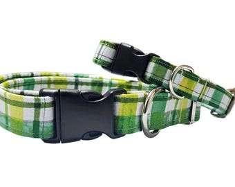 May include: Two green and white plaid dog collars with black plastic buckles and silver D-rings.