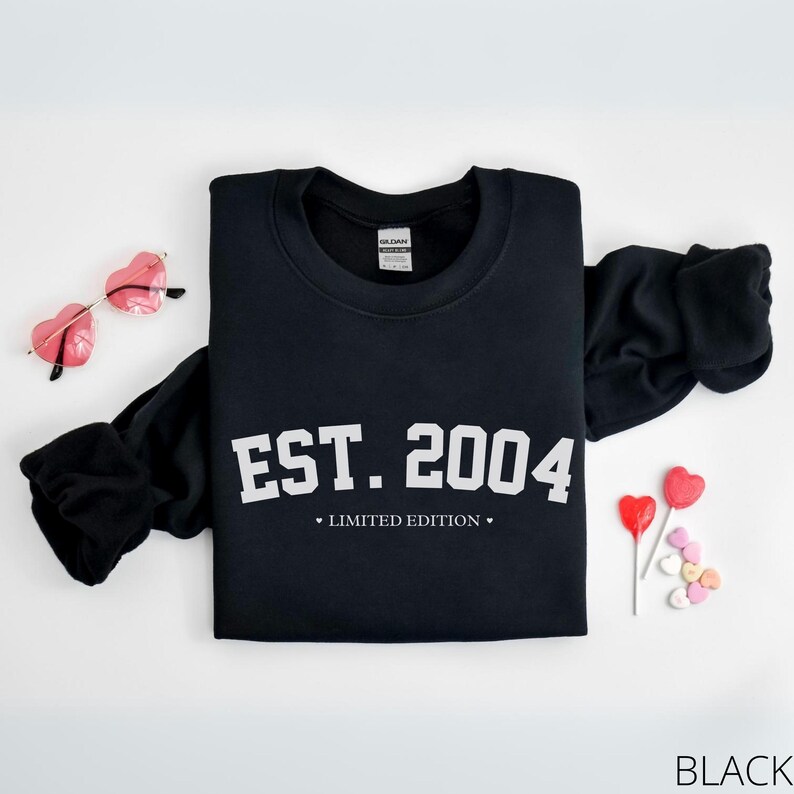 May include: Black sweatshirt with white text that reads "EST. 2004" and "LIMITED EDITION".