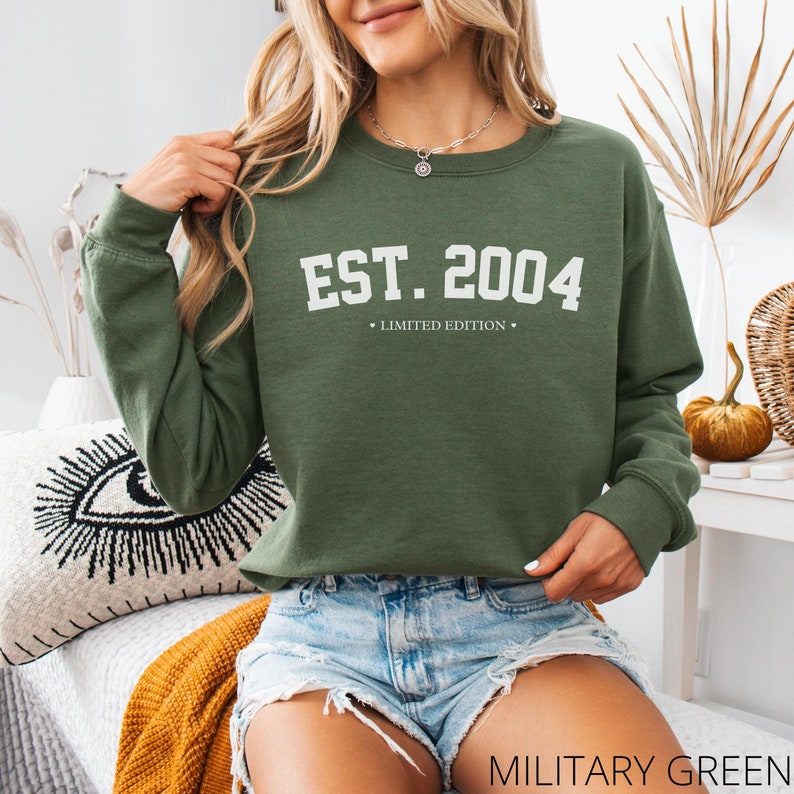 May include: A green sweatshirt with the text "EST. 2004" and "LIMITED EDITION" in white.