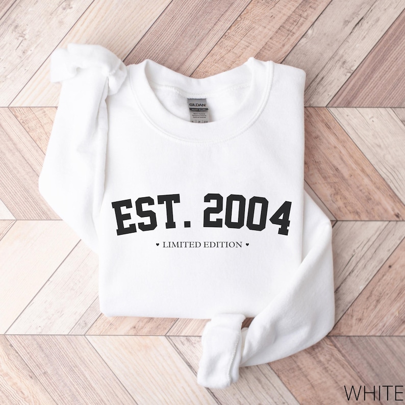 May include: White sweatshirt with black text that reads "EST. 2004 LIMITED EDITION".
