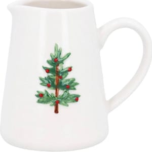 May include: White ceramic pitcher with a curved handle. The pitcher features a green Christmas tree design with red berry accents. The pitcher is a festive addition to any holiday table setting.