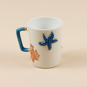 Coffee cup | tea cup | Sea life starfish & shells decorated | Handmade | Ceramics made | With real gold elements | designer cup
