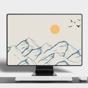 May include: A computer monitor displaying a minimalist digital art print of a mountain range with a yellow sun and black birds flying in the sky. The monitor is on a desk with a white keyboard and a white mouse.