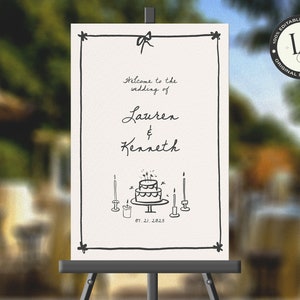 Może przedstawiać: Biały znak ślubny z czarnym napisem i prostą ilustracją tortu weselnego ze świecami. Na znaku widnieje napis "Witamy na ślubie Lauren & Kennetha 07.21.2015".