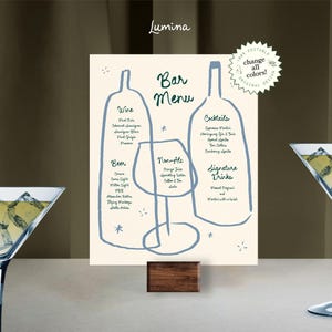 May include: A printable bar menu with a light beige background and blue illustrations of wine bottles and a glass. The menu lists wine, beer, non-alcoholic drinks, cocktails, and signature drinks.