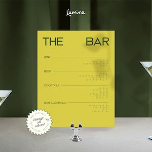 May include: A yellow bar menu with the text "THE BAR" and drink categories: Wine, Beer, Cocktails, and Non Alcoholic. Two martini glasses with olives and ice cubes are on either side of the menu. A small silver bottle holder is in front of the menu.