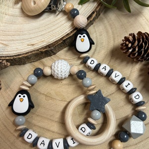 Set Schnullerkette und Greifring 'Pinguin' mit Name aus Holz Bild 1
