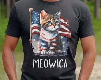 May include: A black t-shirt with a cartoon cat wearing red, white, and blue stripes, standing in front of a tattered American flag. The text "MEOWICA" is printed below the cat.