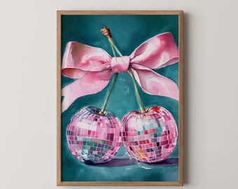 May include: A framed art print featuring two cherries designed as disco balls, connected by stems and a pink bow. The cherries are a mosaic of pink, purple, and silver squares, set against a teal background. The frame is a natural wood color.