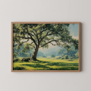 May include: A framed landscape painting depicting a large oak tree with sprawling branches casting shadows on a grassy field. The tree is in the foreground, with rolling hills and a blue sky in the background.