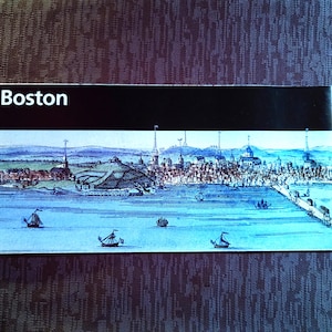 May include: A vintage illustration of the Boston skyline with the word "Boston" printed at the top. The illustration shows the city from the water, with ships sailing in the harbor.