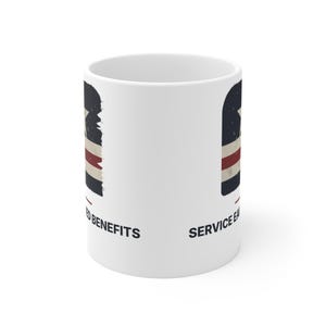 May include: A white ceramic mug featuring a distressed graphic of a star above horizontal stripes in navy, white, and red. The text reads "EARNED BENEFITS" and "SERVICE EARNED" in black capital letters, positioned below the graphic elements.