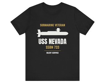 May include: A black short-sleeve t-shirt featuring a white graphic of a submarine. Text in gold and white reads: SUBMARINE VETERAN, USS NEVADA, SSBN 733, and SILENT SERVICE. The design is centered on the chest of the shirt.