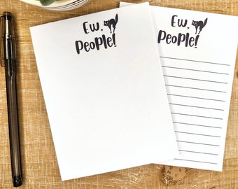 May include: Two white lined notepad pages with a black cat illustration and the text "Ew, People!" printed on each page.