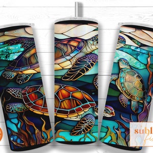 May include: Three stainless steel tumblers with a stained glass design featuring sea turtles and ocean waves. The tumblers are a dark blue, teal, and green color with gold accents.