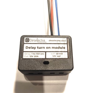 May include: A black electrical module with the text "Deselectra deselectra.com Delay turn on module Delay: 1 to 150 sec Out: 12V 20A with direct 12V out".