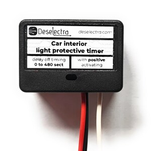 May include: Black car interior light protective timer with a delay off timing of 0 to 480 seconds and positive activation. The timer has two wires, one red and one white.