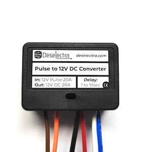May include: A black Pulse to 12V DC Converter with the text "Deselectra" and "Pulse to 12V DC Converter". The converter has several coloured wires extending from the bottom. The converter's dimensions are not visible.