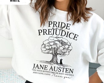 May include: White sweatshirt with a black graphic print of a tree with a couple under it. The text "Pride and Prejudice" is above the tree and "Jane Austen" is below the tree. The quote "You have bewitched me body and soul and I love, I love love you" is below the name.