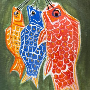 May include: Watercolor painting of three stylized fish in orange, blue, and red, suspended from black strings against a green background. The fish have detailed scales and are painted in a folk art style.