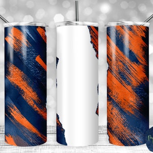 Könnte beinhalten: Drei Edelstahlbecher mit einem Design aus orangefarbenen und blauen Pinselstrichen. Der mittlere Becher ist leer.