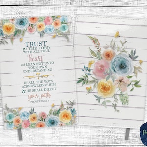 May include: A white journal cover with a floral design and a quote from Proverbs 5:5-6. The quote reads "Trust in the Lord with all your heart and lean not unto your own understanding. In all the ways acknowledge Him & He shall direct your paths."