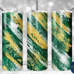 Puede incluir: Tres vasos de acero inoxidable con un diseño abstracto verde, dorado y blanco. El diseño presenta pinceladas y detalles de purpurina.