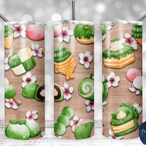 May include: A set of three 20 oz stainless steel tumblers with a watercolor design featuring Japanese sweets and flowers. The tumblers are perfect for everyday use or as a gift.