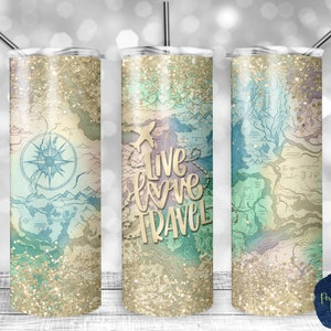 May include: Three stainless steel tumblers with a gold glitter finish and a vintage map design. The center tumbler has the text "Live Love Travel" in gold script.