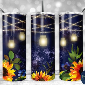 May include: Three stainless steel tumblers with a navy blue background featuring a design of sunflowers, green leaves, and mason jars with lights hanging from them.