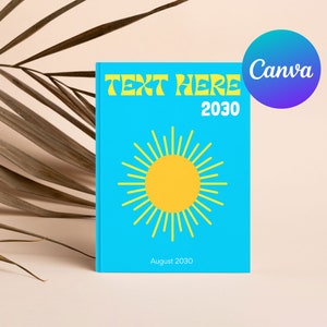 May include: A blue book cover with the text "TEXT HERE 2030" in yellow. A yellow sun with yellow rays is in the centre of the cover. The text "August 2030" is at the bottom of the cover.