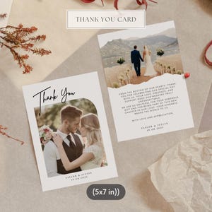 May include: Two wedding thank you cards. One card features a photo of a couple embracing, with the words "Thank You" in elegant script. The second card has a photo of a couple walking away, with a message of gratitude. The cards are 5x7 inches.