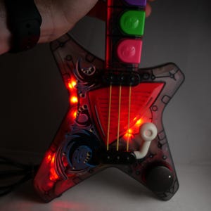 Repurposed Toy Guitar MIDI Controller: 7-Button DAW Music Interface