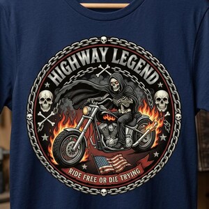 May include: A navy blue t-shirt featuring a circular graphic of a skeleton in a black cloak riding a motorcycle through flames. The text reads HIGHWAY LEGEND and RIDE FREE OR DIE TRYING, accompanied by skulls, chains, and an American flag.