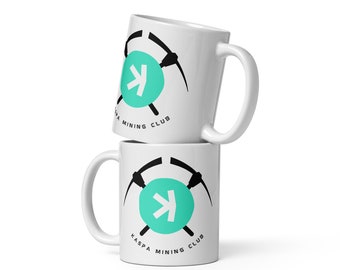 May include: Two white ceramic mugs stacked. Each mug has a teal circle with a white arrow, black pickaxes, and the text "KASPA MINING CLUB" in black.