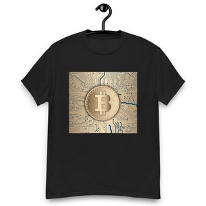 May include: Black t-shirt with a gold and blue graphic of a Bitcoin symbol on a circuit board background.