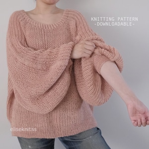 May include: A downloadable knitting pattern for a loose-fitting, oversized sweater with a round neckline and long, voluminous sleeves. The sweater is shown in a pale pink color.