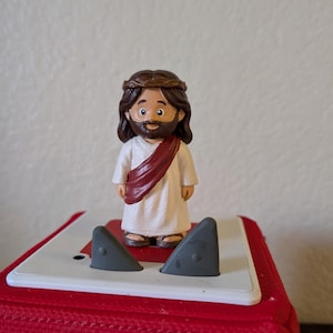 May include: A set of three ceramic mugs with a speckled, matte finish. The mugs are in shades of cream, light gray, and dark gray. Each mug has a simple, minimalist design and a rounded handle.