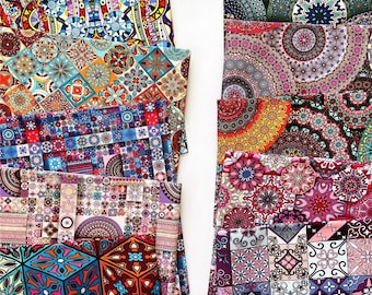 May include: A stack of colorful fabric squares with geometric patterns. The fabric is printed with intricate designs featuring circles, squares, and other shapes. The fabric is perfect for quilting, crafting, or home decor projects.