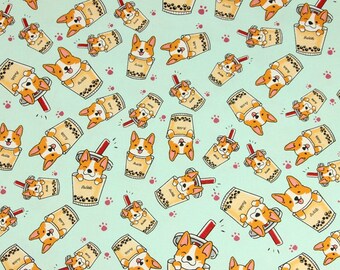 May include: A repeating pattern of cartoon corgis in a bubble tea cup on a light blue background. The corgis are wearing a brown and orange coat and have a white chest. The bubble tea cups are light brown with black boba pearls and a red straw. The background is light blue with pink paw prints.