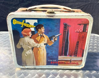 Vintage metalen lunchbox met geheim agent-thema uit 1968 van King Seeley Thermos Co.
