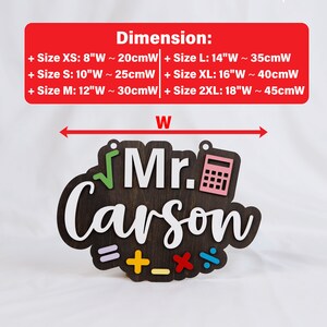 May include: A wooden sign with the text "Mr. Carson" in white lettering. The sign is decorated with colorful math symbols and a pink calculator. The sign is available in various sizes, ranging from 8 inches to 18 inches wide.
