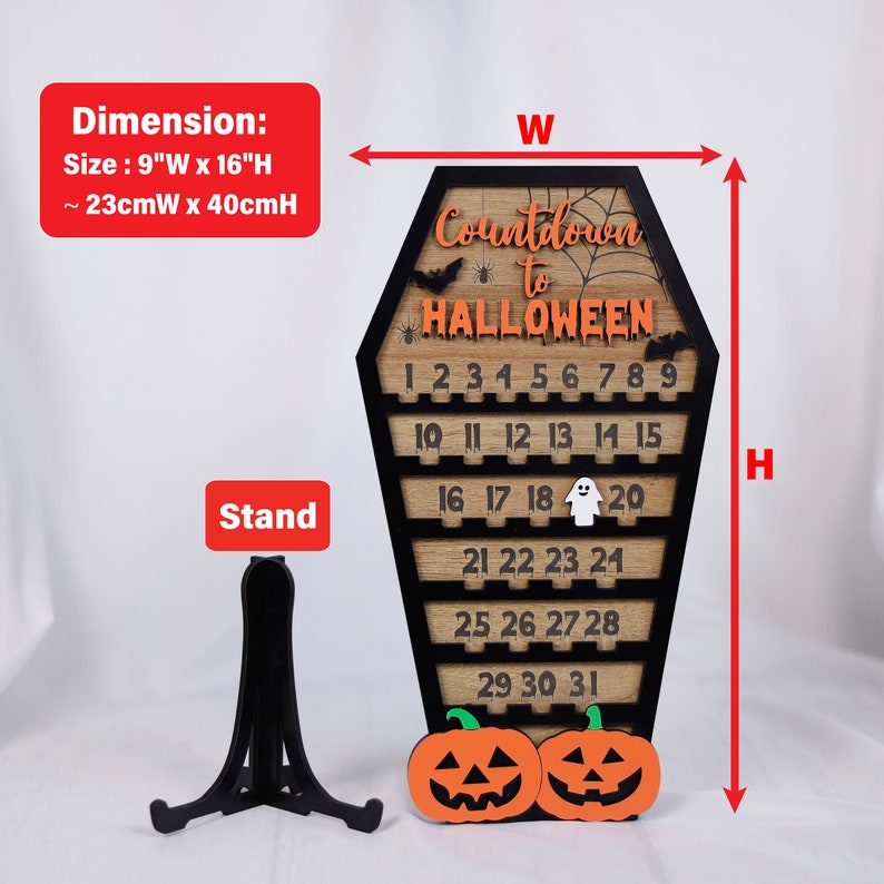 May include: Wooden Halloween countdown calendar shaped like a coffin with a black frame and orange and black numbers. The calendar is 9 inches wide and 16 inches tall. It includes a stand for displaying.